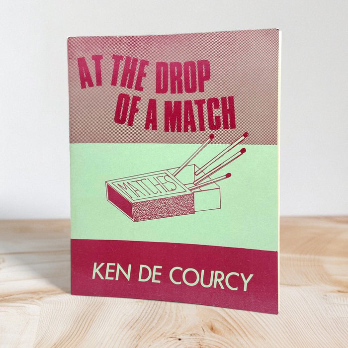 At the Drop of a Match by Ken De Courcy